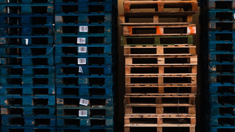 Tall stacks of wooden pallets