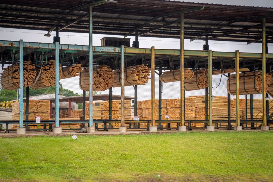 Bundles of lumber under a covered mill shed