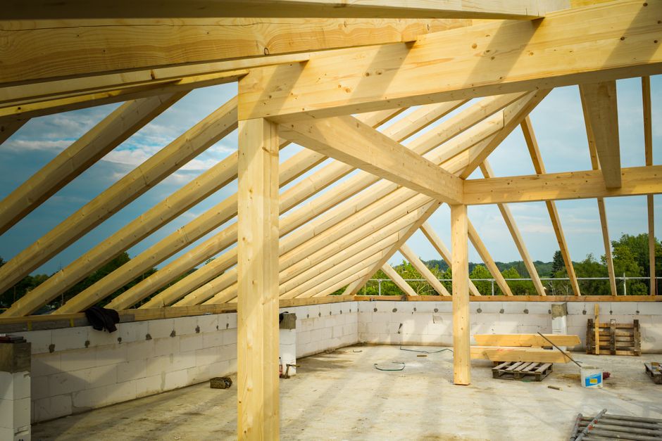 Exposed timber roof framing on a building under construction